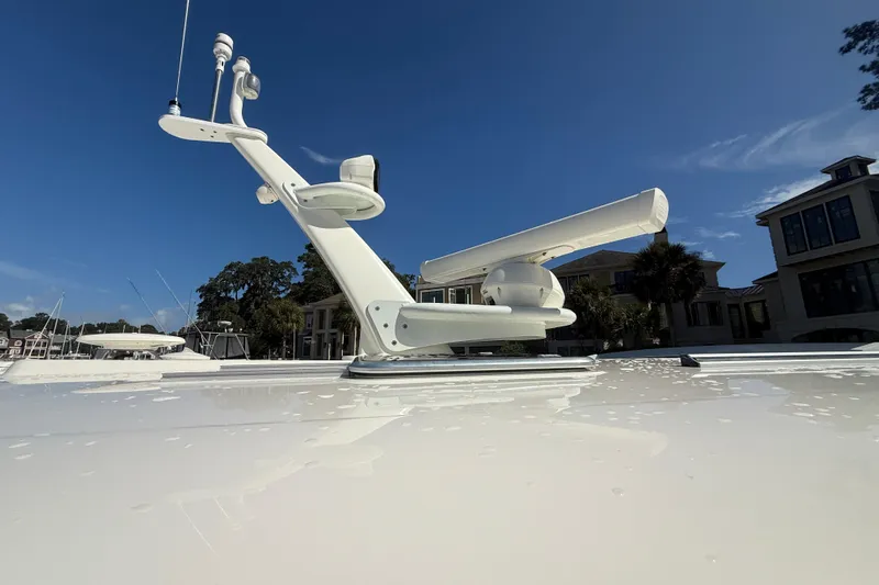 Strange Magic Yacht Photos Pics Radar equipment on 2023 Sabre 43 Salon Express yacht under clear blue sky.