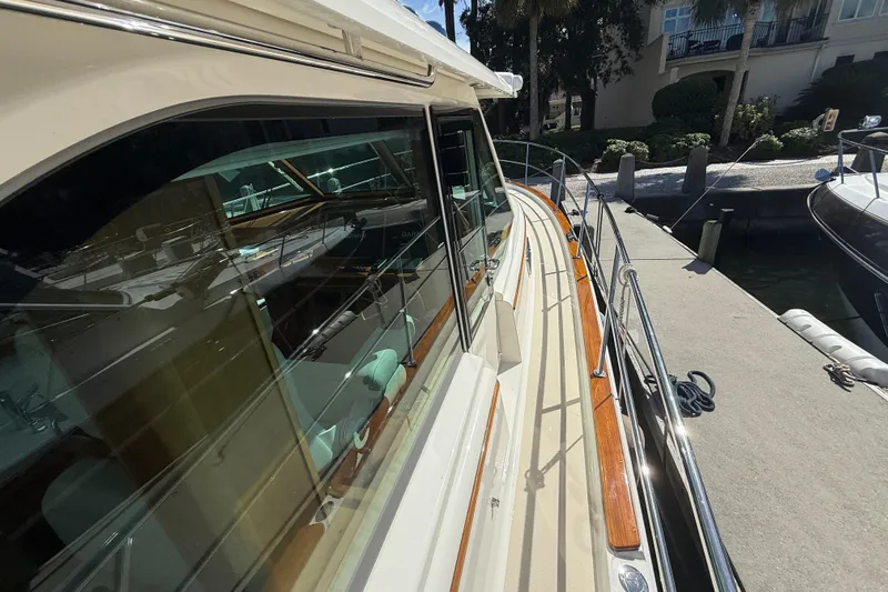 Strange Magic Yacht Photos Pics 2023 Sabre 43 Salon Express yacht docked, showcasing sleek design and polished wood accents.