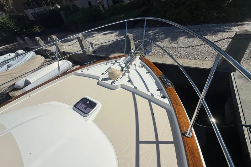 Strange Magic Yacht Photos Pics 2023 Sabre 43 Salon Express yacht bow with stainless steel railings at dock.