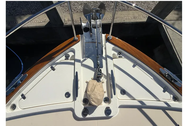 Strange Magic Yacht Photos Pics Bow of 2023 Sabre 43 Salon Express with anchor and teak accents.