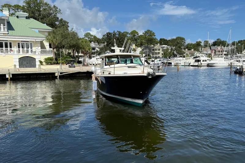 Strange Magic Yacht Photos Pics 2023 Sabre 43 Salon Express yacht docked in a scenic marina setting.