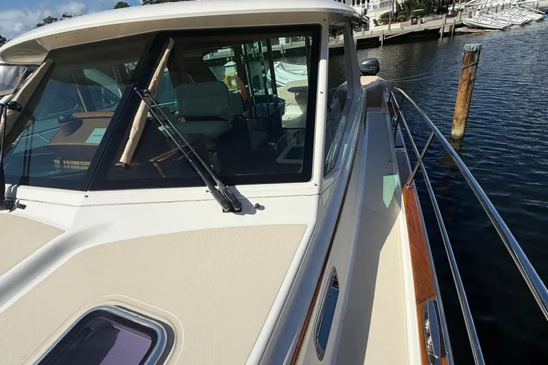 Strange Magic Yacht Photos Pics 2023 Sabre 43 Salon Express yacht docked at marina, showcasing sleek design and spacious deck.