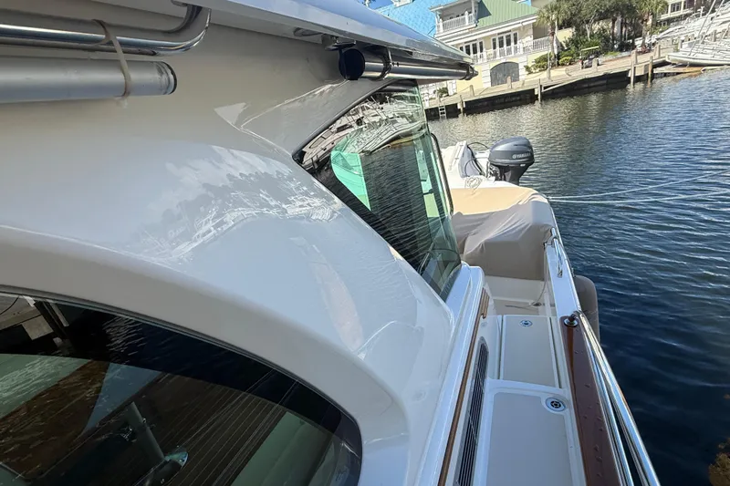 Strange Magic Yacht Photos Pics 2023 Sabre 43 Salon Express yacht docked by waterfront homes.