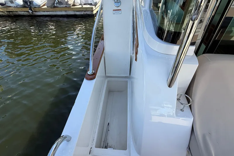 Strange Magic Yacht Photos Pics 2023 Sabre 43 Salon Express boat deck with railing and water view.