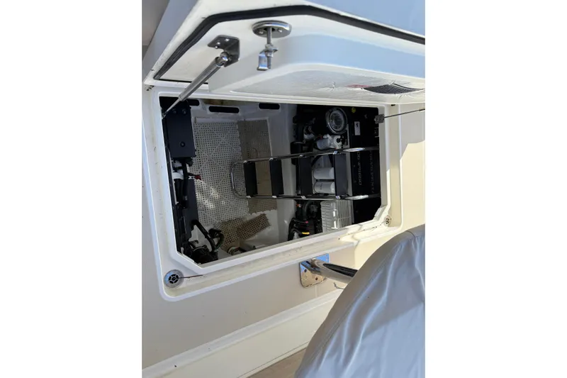 Strange Magic Yacht Photos Pics Engine compartment of 2023 Sabre 43 Salon Express yacht, showcasing mechanical components.