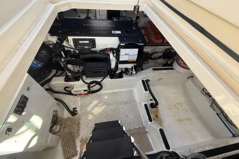 Strange Magic Yacht Photos Pics Engine compartment of 2023 Sabre 43 Salon Express, showcasing mechanical components and layout.