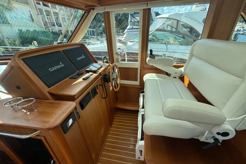 Strange Magic Yacht Photos Pics 2023 Sabre 43 Salon Express helm with Garmin displays and luxurious seating.