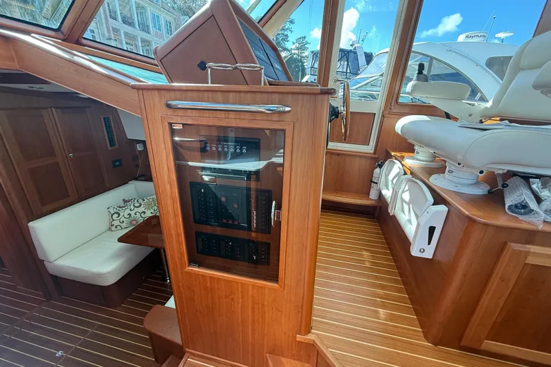 Strange Magic Yacht Photos Pics 2023 Sabre 43 Salon Express interior with wood finish and seating area.