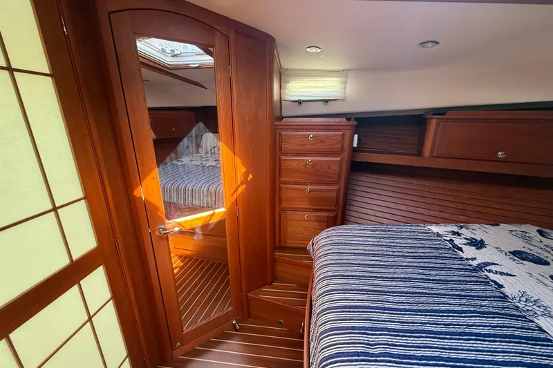 Strange Magic Yacht Photos Pics Luxurious interior of 2023 Sabre 43 Salon Express yacht cabin with wooden finishes.