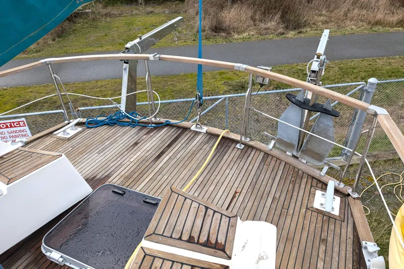 Firefly Yacht Photos Pics Deck of 1985 Siltala Nauticat 44 sailboat with wooden flooring and anchor.