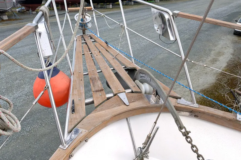 Firefly Yacht Photos Pics 1985 Siltala Nauticat 44 sailboat deck with anchor and orange buoy.