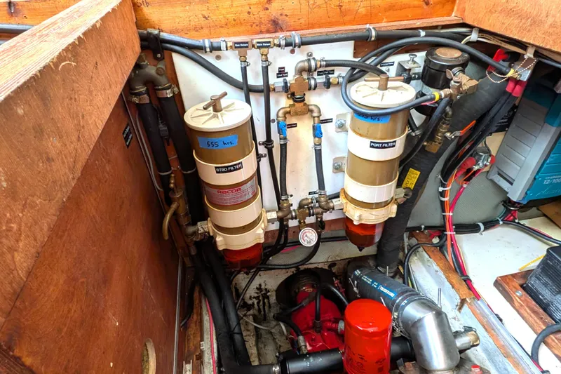 Firefly Yacht Photos Pics Engine room of 1985 Siltala Nauticat 44, featuring fuel filters and piping system.