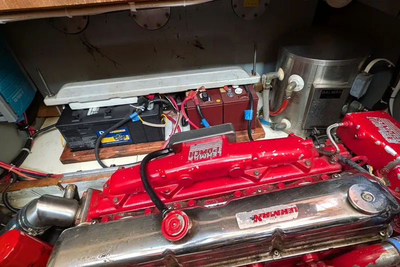 Firefly Yacht Photos Pics Engine room of 1985 Siltala Nauticat 44 with red engine and battery setup.