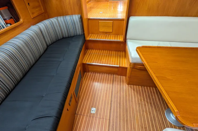 Firefly Yacht Photos Pics Interior of 1985 Siltala Nauticat 44 yacht with wooden flooring and seating.