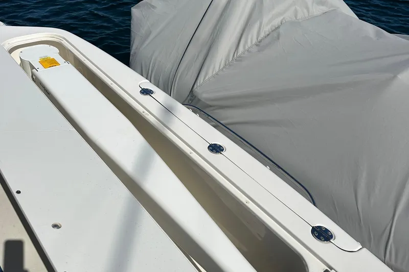 Knot Available Yacht Photos Pics 2005 Sea Ray 500 Sedan Bridge deck with covered equipment, near water.