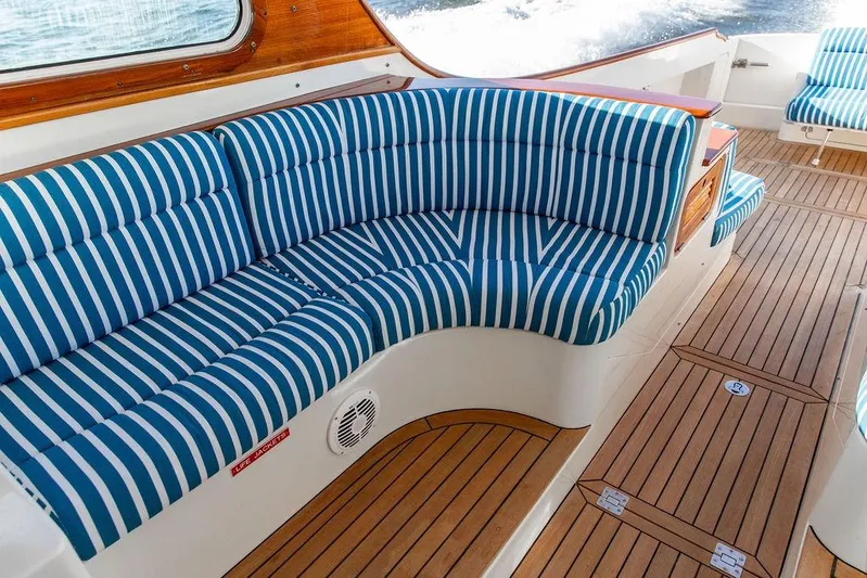 Checkout Time Yacht Photos Pics Luxurious 2007 Hinckley Talaria 40 yacht interior with striped seating and teak flooring.