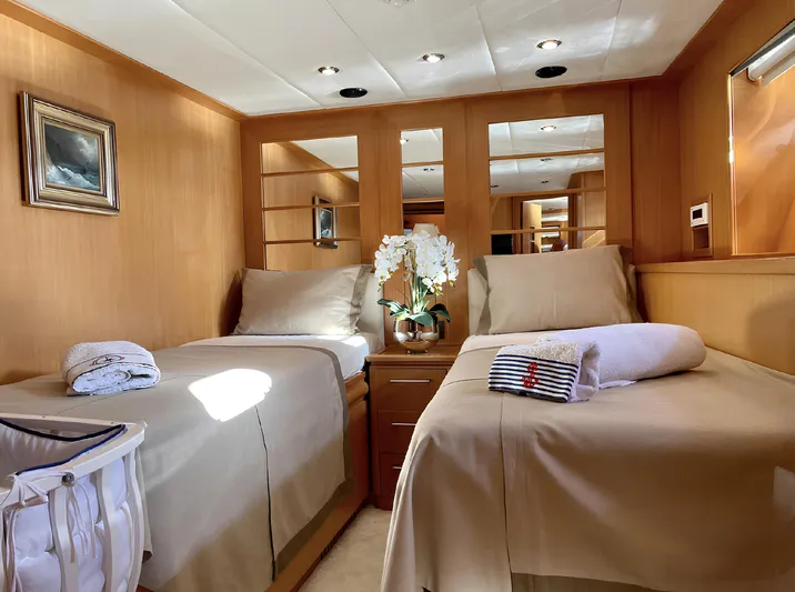 Yacht Photos Pics Luxurious twin cabin interior on a 2008 Custom 34 yacht, featuring elegant decor and comfortable bedding.