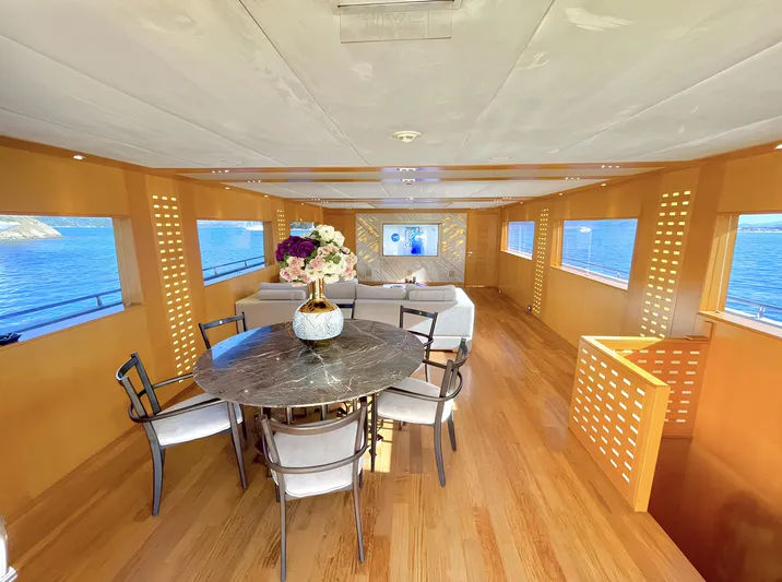  Yacht Photos Pics Luxurious yacht interior with dining area, Custom model 34, 2008, featuring ocean views.