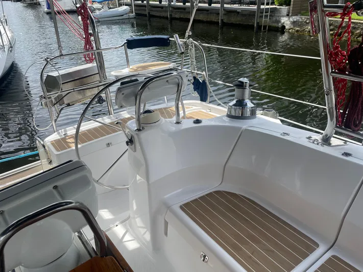 Sailing Diver Yacht Photos Pics Hunter 49 Aft Cockpit 2010 sailboat with sleek design, docked at marina.