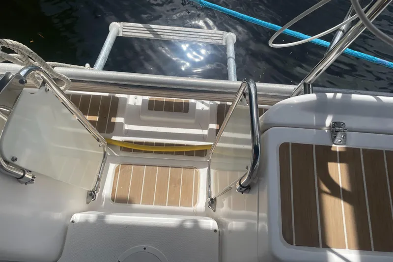 Sailing Diver Yacht Photos Pics Hunter 49 Aft Cockpit 2010 sailboat with teak deck and stainless steel railings.