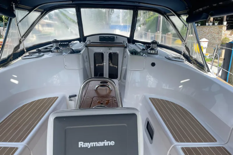 Sailing Diver Yacht Photos Pics Cockpit of 2010 Hunter 49 Aft, featuring Raymarine equipment and sleek design.