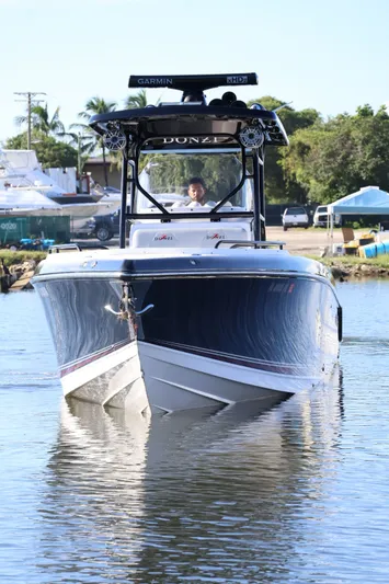  Yacht Photos Pics 2012 Donzi 38 ZF boat on water, front view, with Garmin equipment.