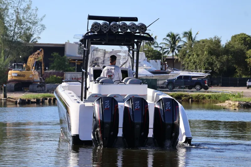 Yacht Photos Pics 2012 Donzi 38 ZF boat with quad engines on a calm waterway.