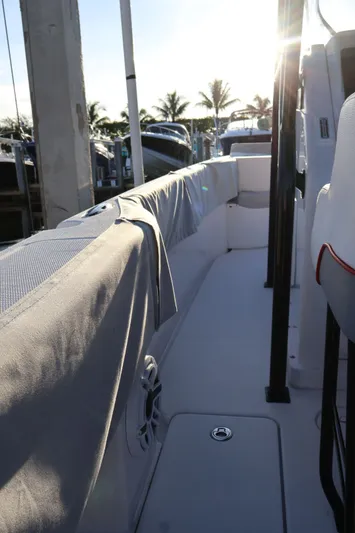  Yacht Photos Pics 2012 Donzi 38 ZF boat interior with sunlit seating and marina backdrop.