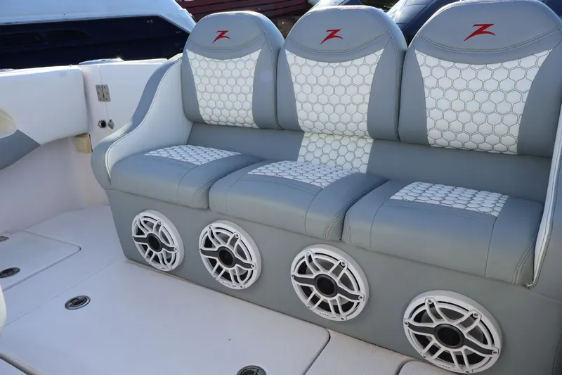  Yacht Photos Pics 2012 Donzi 38 ZF boat interior with gray seating and built-in speakers.