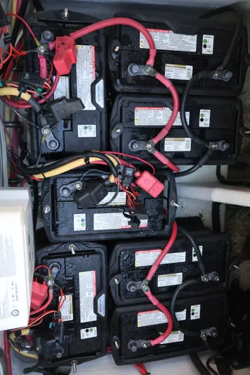  Yacht Photos Pics Battery setup in a 2012 Donzi 38 ZF boat, featuring multiple connected batteries.