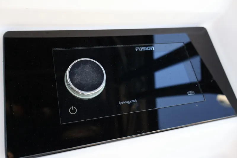 Yacht Photos Pics Fusion audio control panel on 2012 Donzi 38 ZF boat, featuring a sleek design.