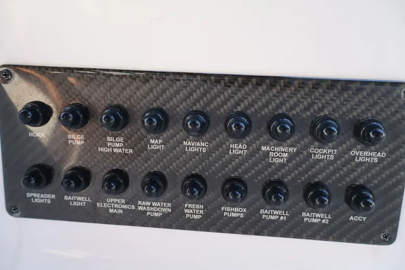  Yacht Photos Pics Control panel of a 2012 Donzi 38 ZF boat with labeled switches.