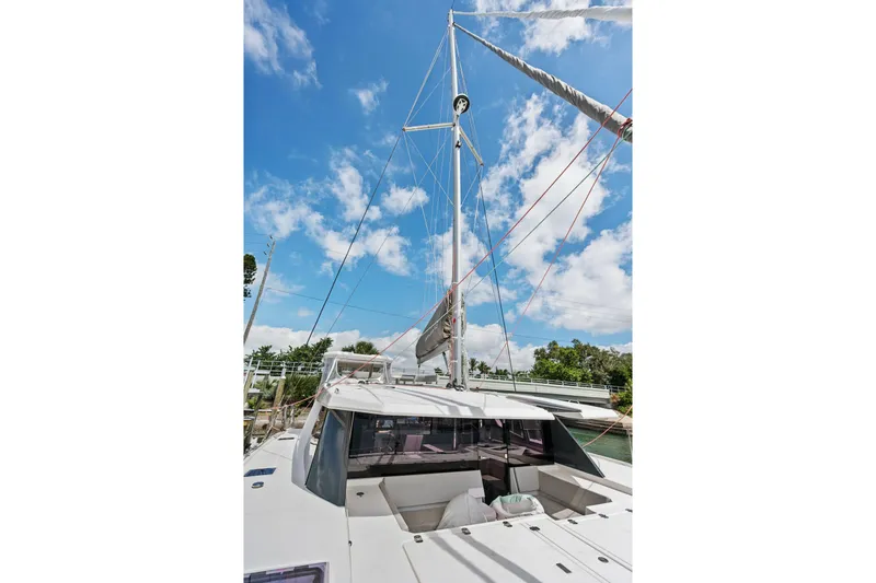 Always Wet Yacht Photos Pics 2021 Leopard 45 yacht with sails, under a clear blue sky.