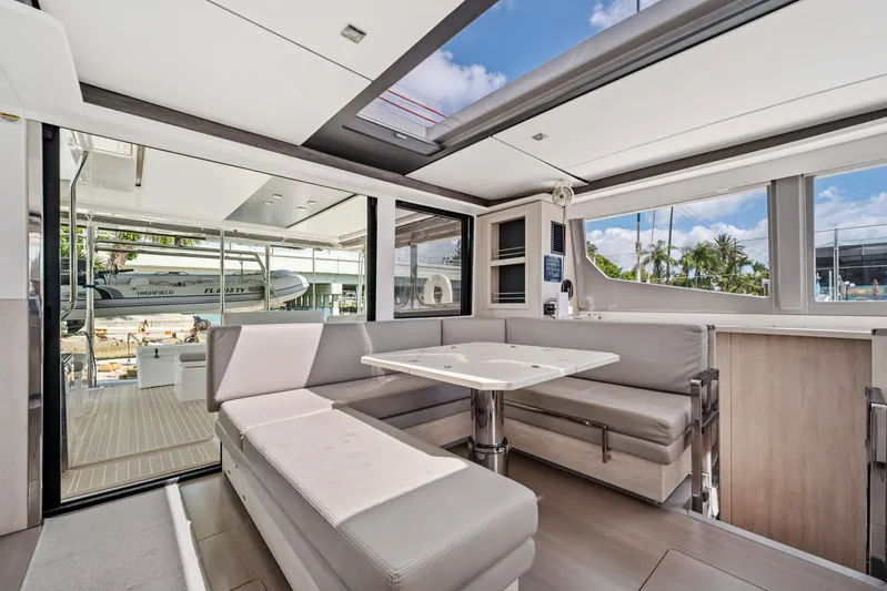 Always Wet Yacht Photos Pics Modern interior of 2021 Leopard 45 yacht with spacious seating and large windows.