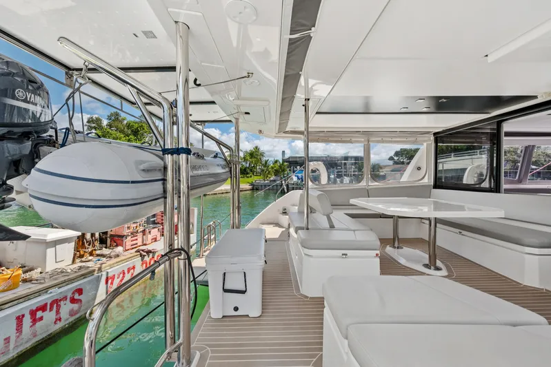 Always Wet Yacht Photos Pics Luxurious 2021 Leopard 45 catamaran with spacious deck, seating, and Yamaha motor.