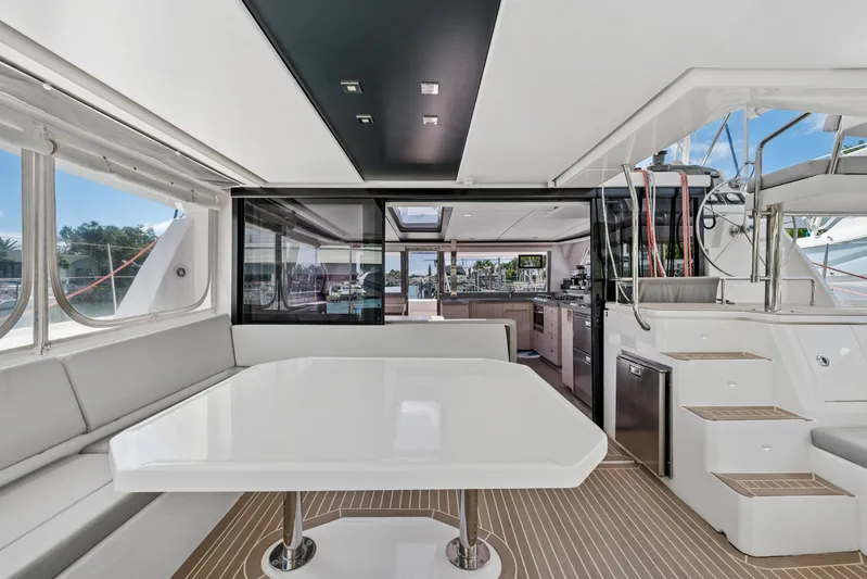 Always Wet Yacht Photos Pics Luxurious interior of 2021 Leopard 45 yacht with modern dining area and kitchen.