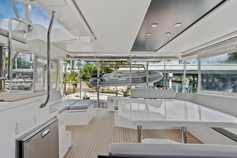Always Wet Yacht Photos Pics Luxurious 2021 Leopard 45 yacht interior with modern seating and dining area.