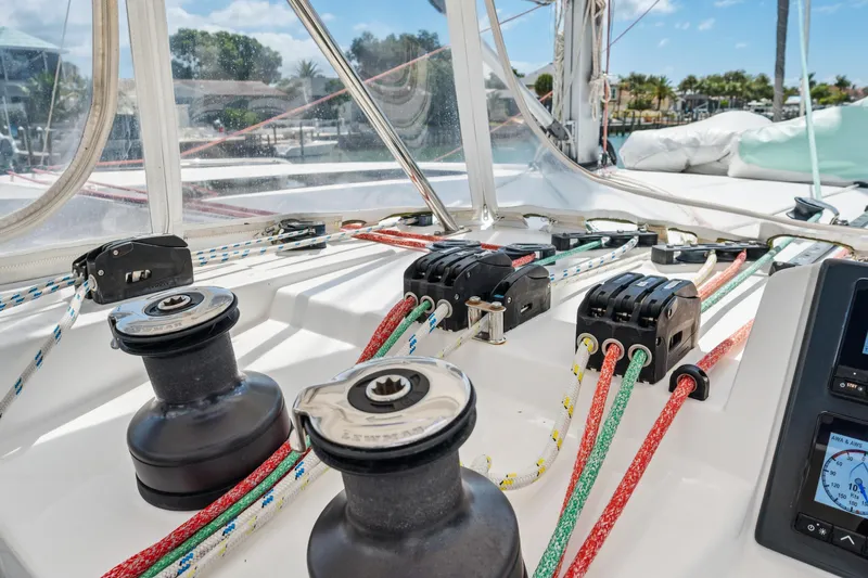 Always Wet Yacht Photos Pics Sailing equipment on a 2021 Leopard 45 catamaran, featuring winches and colorful ropes.