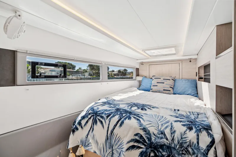 Always Wet Yacht Photos Pics Luxurious bedroom interior of 2021 Leopard 45 yacht with scenic window views.