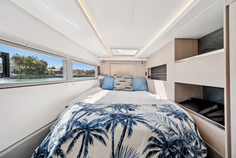 Always Wet Yacht Photos Pics Luxurious 2021 Leopard 45 yacht bedroom with scenic window view.