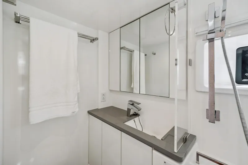 Always Wet Yacht Photos Pics Modern bathroom in 2021 Leopard 45 yacht with sleek fixtures and mirrored cabinets.