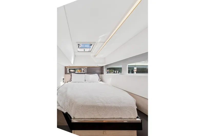 Always Wet Yacht Photos Pics Luxurious bedroom interior of 2021 Leopard 45 yacht with skylight and modern design.