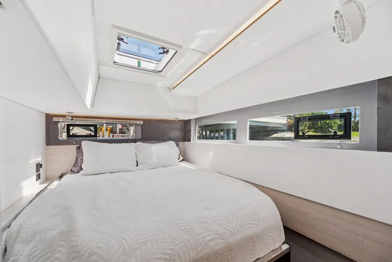 Always Wet Yacht Photos Pics Luxurious bedroom interior of 2021 Leopard 45 yacht with skylight and modern design.