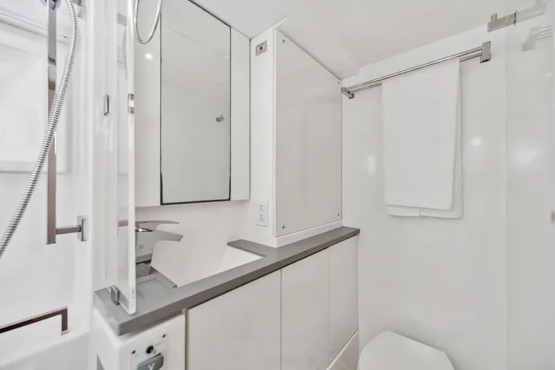 Always Wet Yacht Photos Pics Modern bathroom in 2021 Leopard 45 yacht, featuring sleek fixtures and minimalist design.