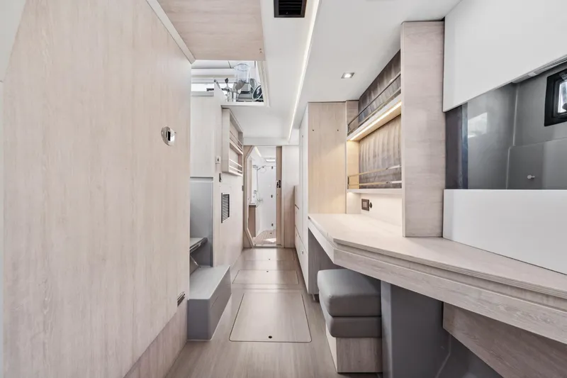 Always Wet Yacht Photos Pics Modern interior of 2021 Leopard 45 yacht with sleek wooden finishes and ambient lighting.