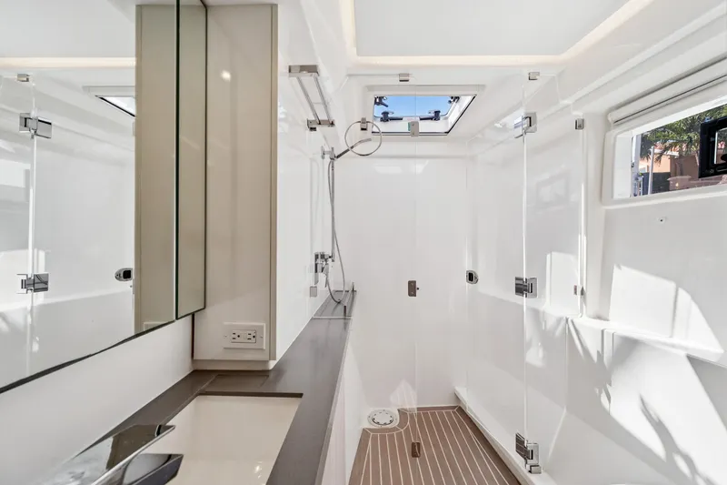 Always Wet Yacht Photos Pics Modern bathroom interior on 2021 Leopard 45 yacht, featuring sleek design and natural light.