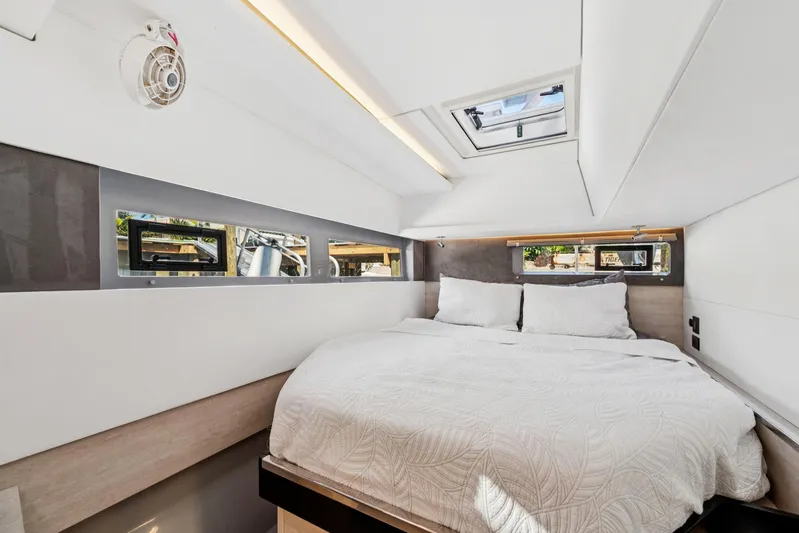 Always Wet Yacht Photos Pics Luxurious bedroom interior of 2021 Leopard 45 catamaran with modern design and skylight.