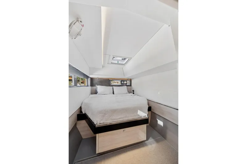 Always Wet Yacht Photos Pics Luxurious bedroom interior of 2021 Leopard 45 yacht with modern design and skylight.