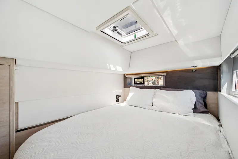 Always Wet Yacht Photos Pics Luxurious bedroom interior of 2021 Leopard 45 yacht with skylight and modern design.