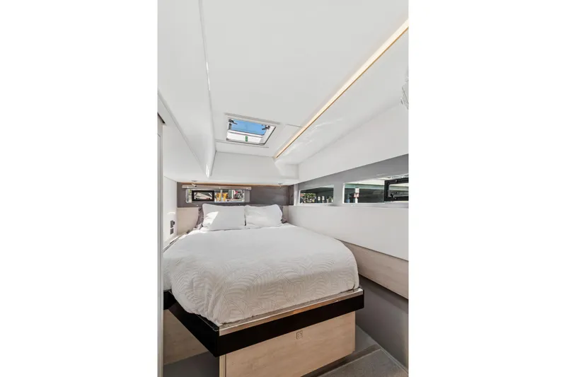 Always Wet Yacht Photos Pics Luxurious bedroom interior of 2021 Leopard 45 yacht with skylight and modern design.